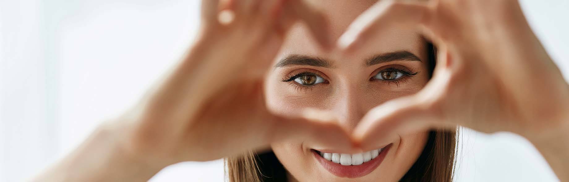 woman making heart sign