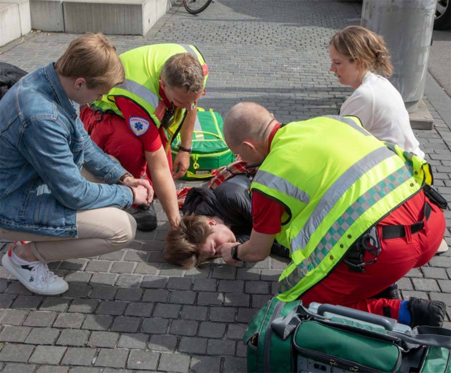 rescue team helping sick boy